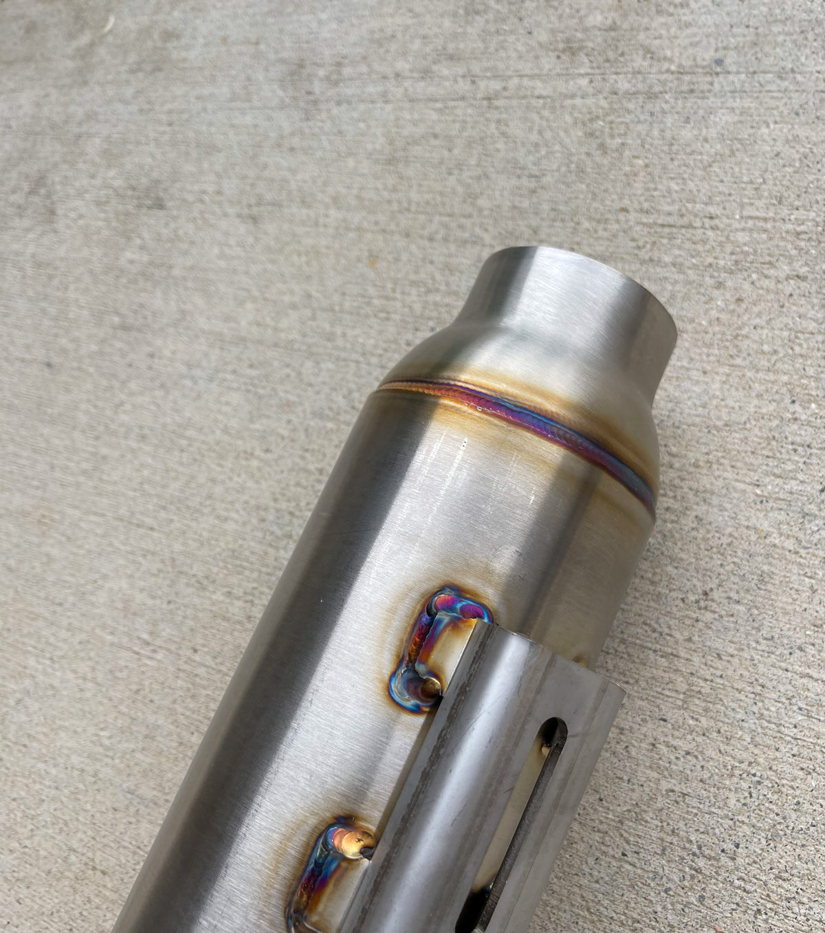 Close-up of Stealth Pipes Pipe Bomb Muffler – stainless TIG welds and engraved logo, photo 7 of 9