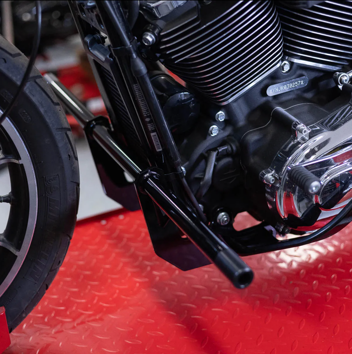 A black metal Dyna Crash Bar designed for motorcycle stunt riding, includes two Delrin sliders., photo 5 of 5
